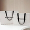 Sacs à provisions cosmétiques de luxe faits sur commande d'habillement de sacs en papier avec des poignées